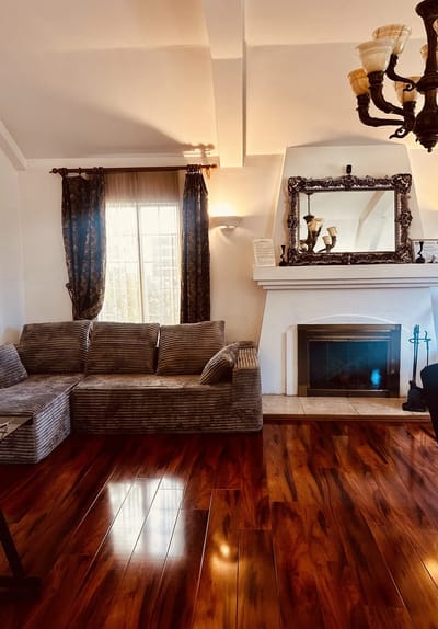 Cozy seating area in a common room with fireplace