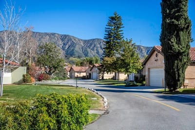 Scenic view of a residential street with mountains