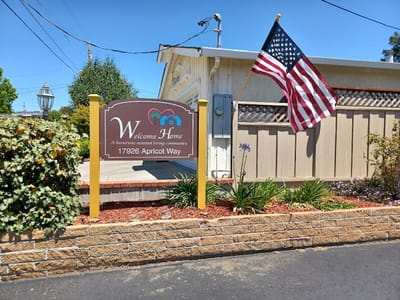 Welcome Home facility sign with American flag