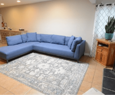 Cozy common area with a blue sectional sofa