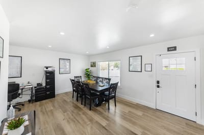 Bright, modern common area with dining table