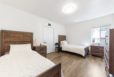 Bright and welcoming resident room with two beds