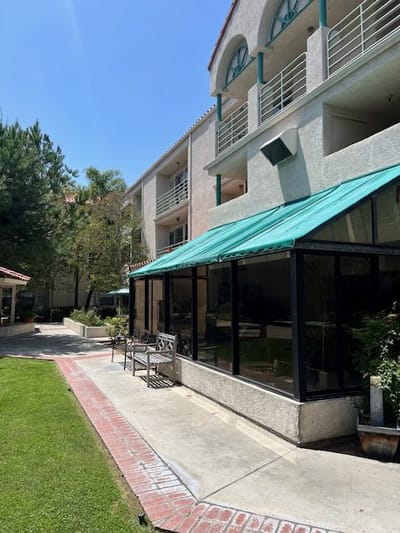 Exterior view of the facility with outdoor seating area