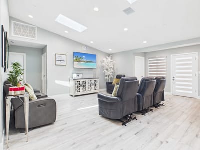 Cozy common area with seating and a TV