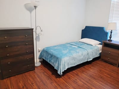 A simple, nicely arranged resident bedroom