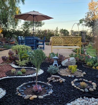 Well-maintained garden area with seating and landscaping