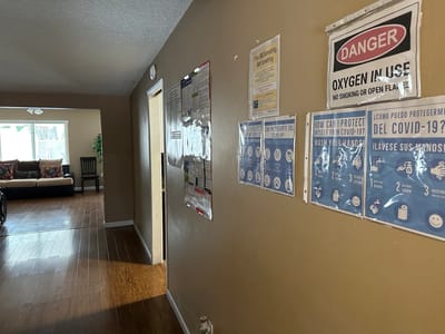 Interior hallway with signage about safety and COVID-19