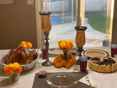 A beautifully set table for a Thanksgiving meal