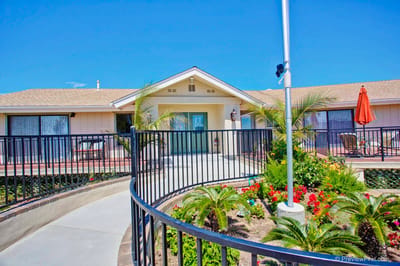 Entrance of assisted living facility with gardens