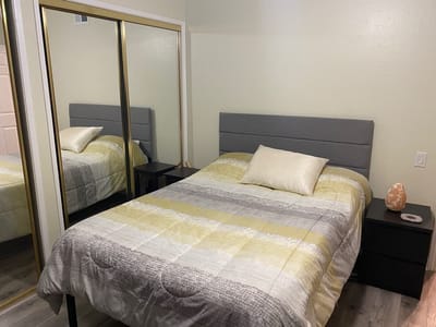 Cozy bedroom setup with a bed and mirror