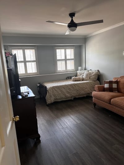 Cozy resident room with a bed and seating area