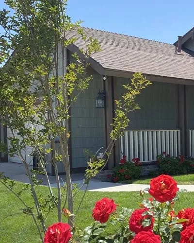 Exterior view of a residence with flowers