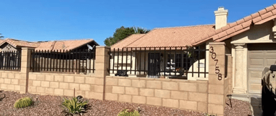 Exterior view of a residential care facility with fence