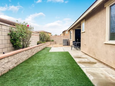 Backyard space with garden and patio area