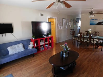 Bright common area with seating and dining table