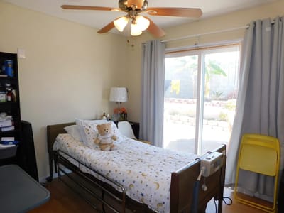 Private resident room with a bed and stuffed animal