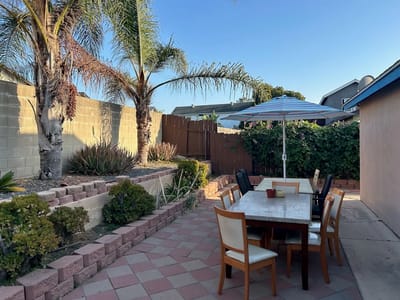 Outdoor seating area with patio furniture and plants