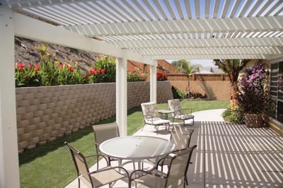 Patio area with seating and lush landscaping
