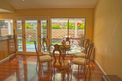 Bright dining area with a large table and chairs