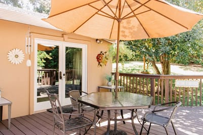 Outdoor patio with seating and an umbrella