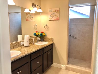 Clean and bright bathroom with double vanities