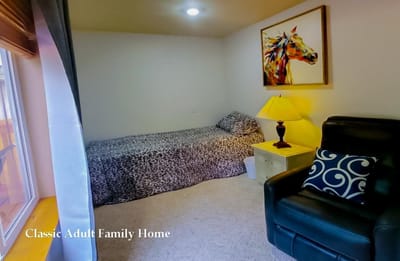 Cozy resident room with bed and lamp