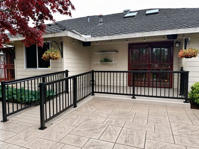 Outdoor space with patio and railing