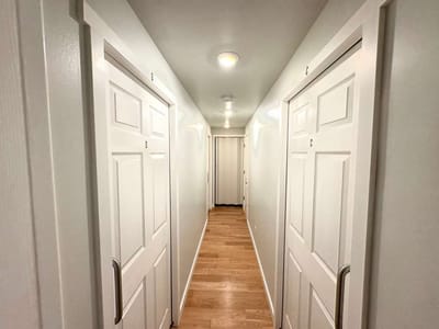 Narrow hallway with doors in a nursing home