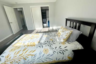 A beautifully decorated resident bedroom with a floral bedspread