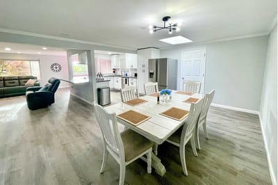 Bright dining area with a wooden table and chairs