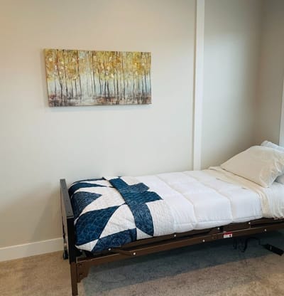 A well-made bed in a residential room