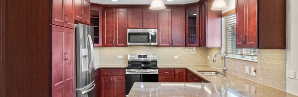 Bright kitchen area with modern appliances