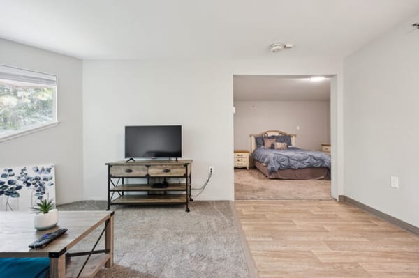 A welcoming space featuring a living area and bedroom, promoting comfort and com