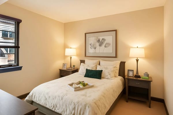 Senior living bedroom with spacious layout and calming design