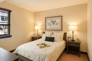 Senior living bedroom with spacious layout and calming design
