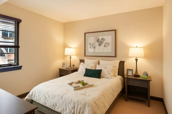 Senior living bedroom with spacious layout and calming design