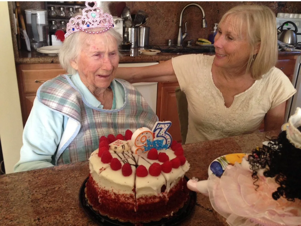 Resident celebrating birthday with family and cake