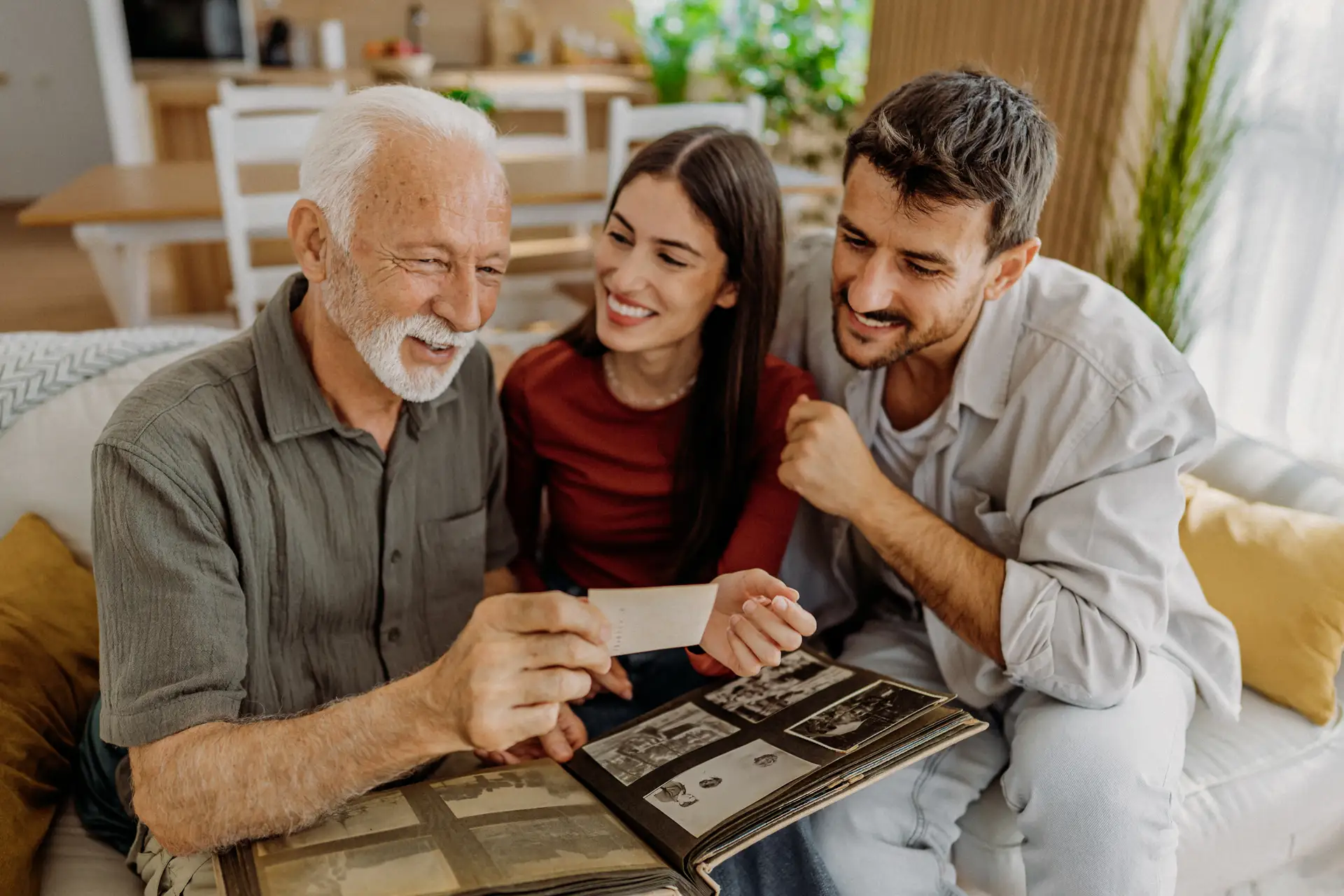Family enjoying time together while looking at a photo album