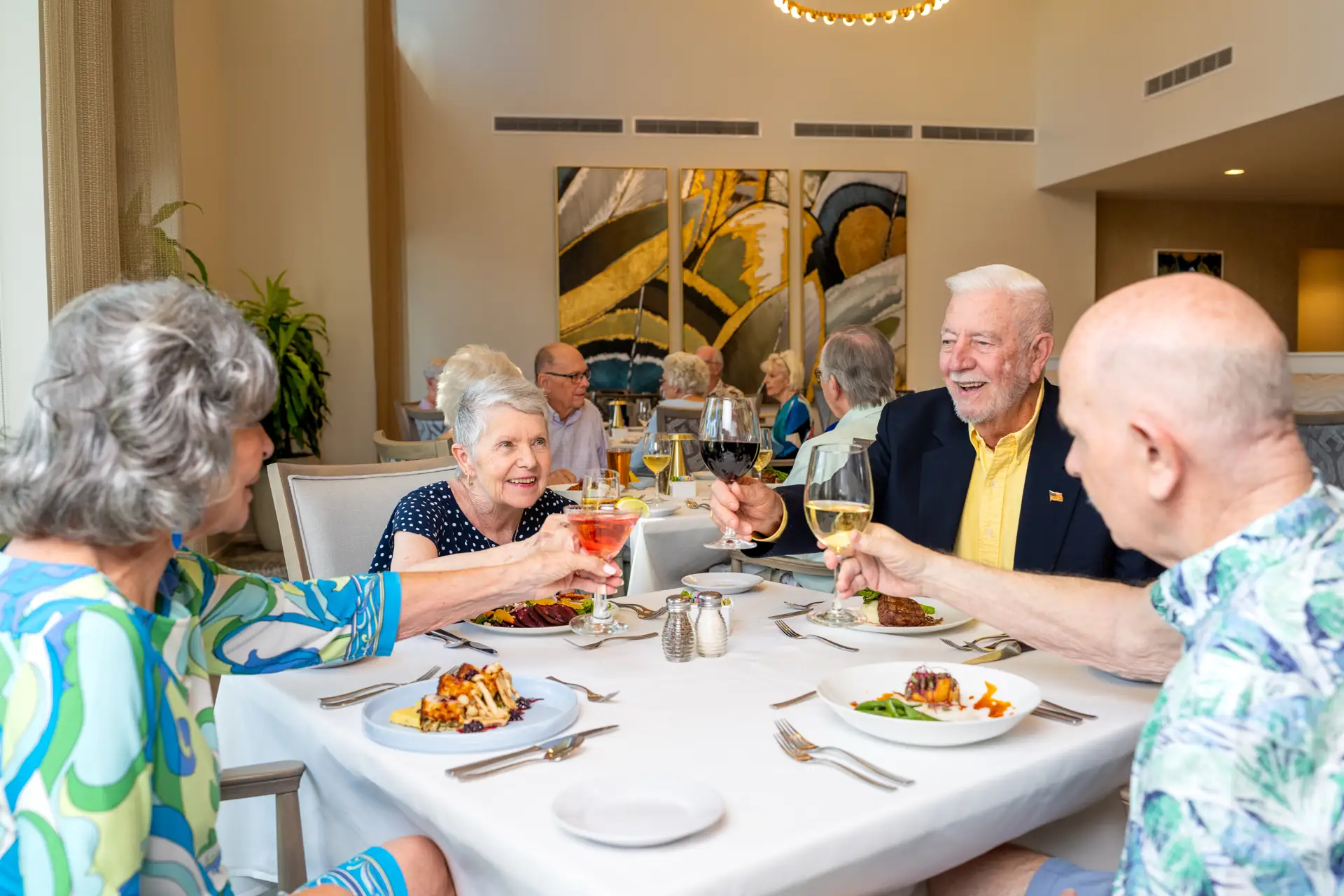 Residents enjoying a meal together in the dining area