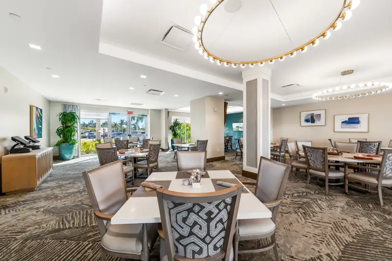 Bright dining area with modern furniture and artwork