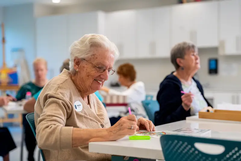 Residents participating in an art activity at a common area