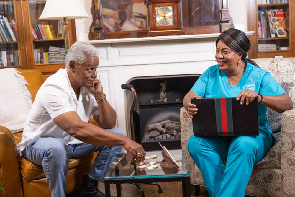 Two residents engaged in a board game activity.