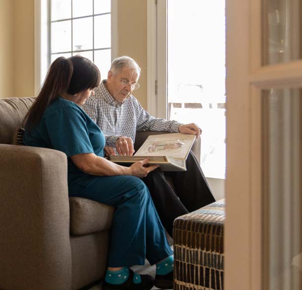 Staff member reading with a resident