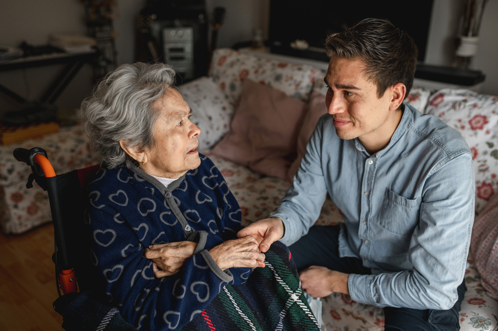 A caregiver interacts with a senior resident.