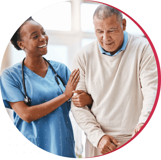 Caregiver assisting a senior resident indoors.
