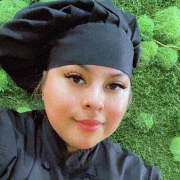 Close-up of a chef in a black uniform