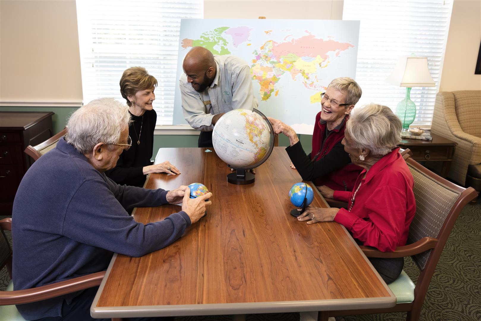 Residents engaging in an interactive globe activity