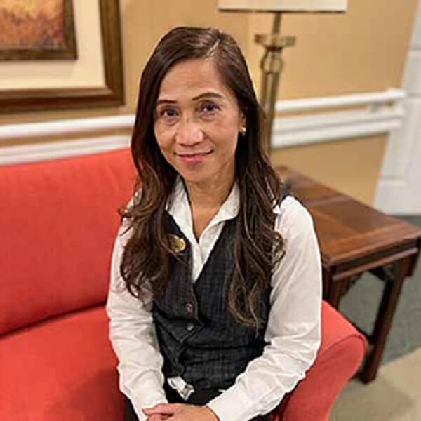 Staff member posing in a common area