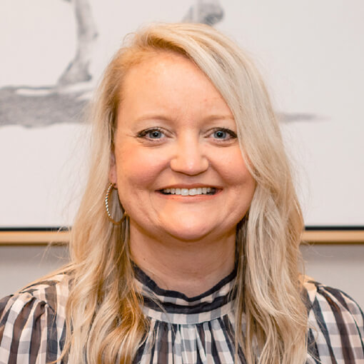 Portrait of a staff member smiling at the facility