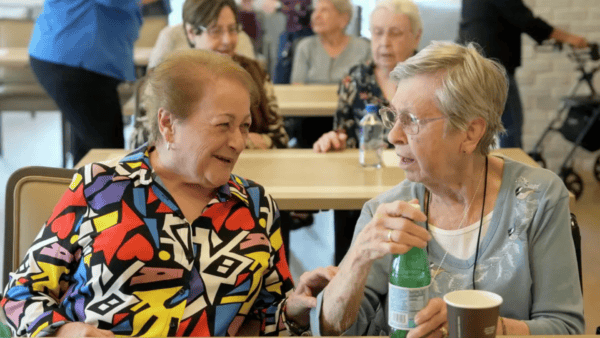 Residents enjoying a conversation in a common area